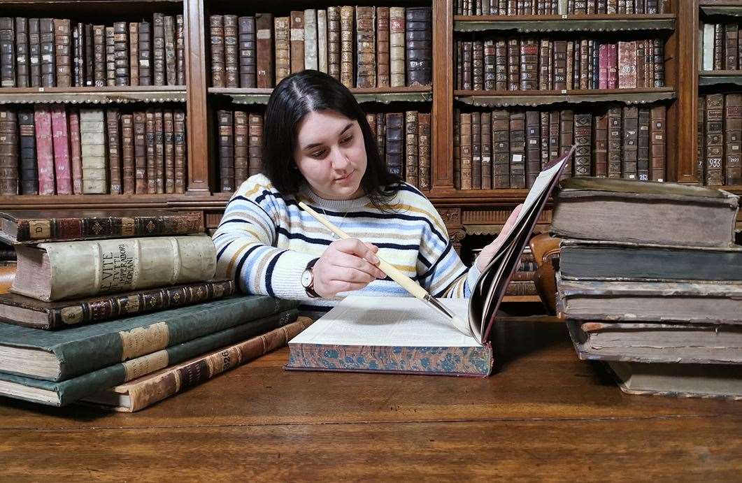 A volunteer helps to conserve some of the books contained within the original collection at Spalding Gentlemen's Society PHOTO: Spalding Gentlemen's Society