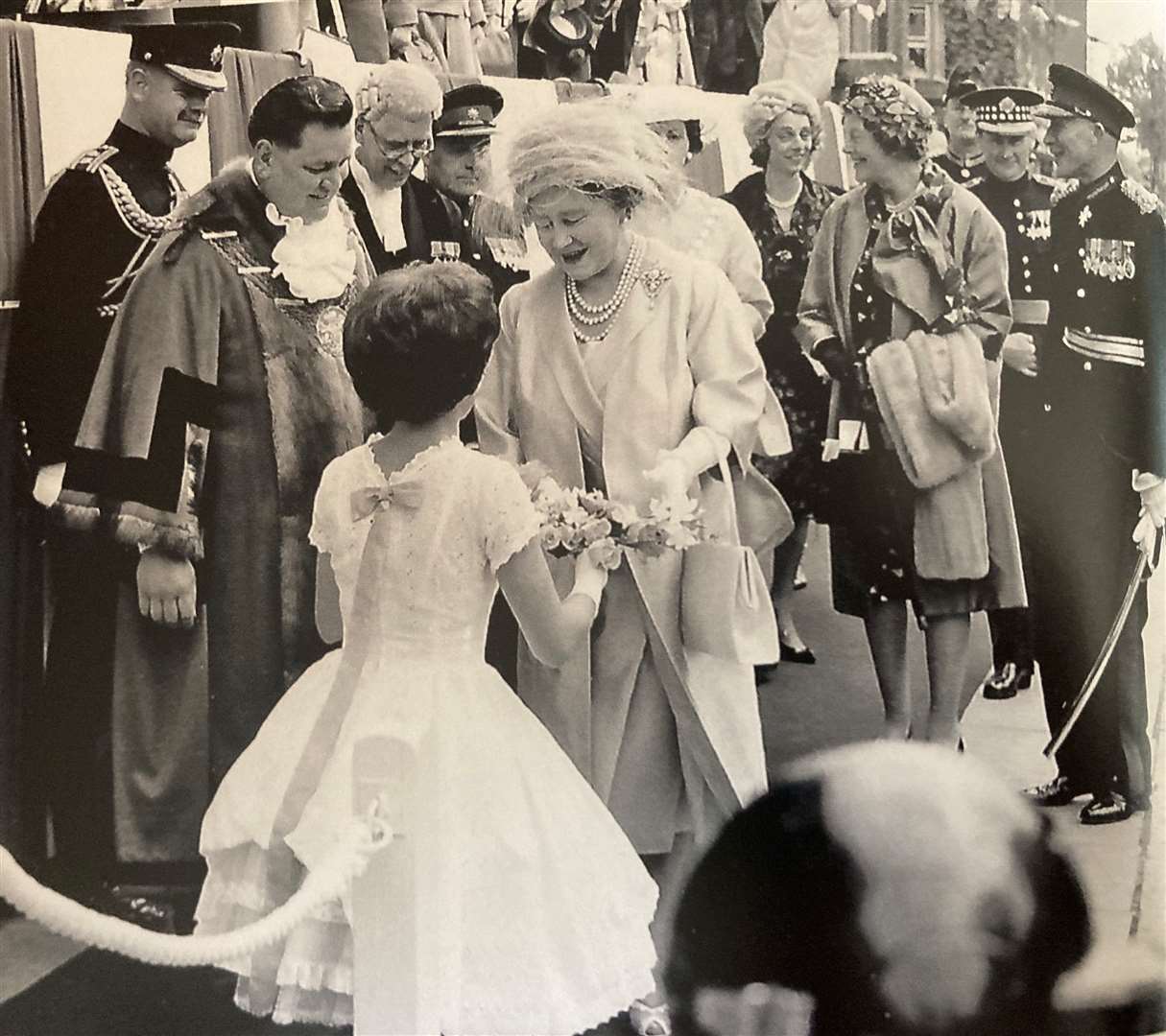 Joan when she met the Queen Mother.