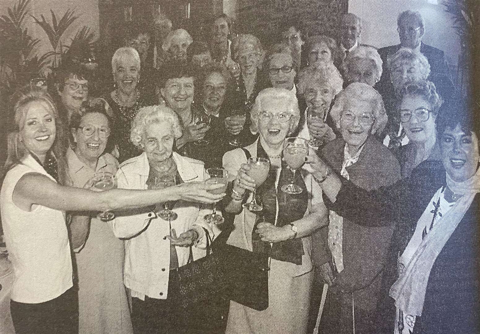 Volunteers from the Imperial Cancer Research Fund led by area manager Carole Parker and Stamford shop manager Sandra Brunkskill toast to 10 years in Stamford 25 years ago.