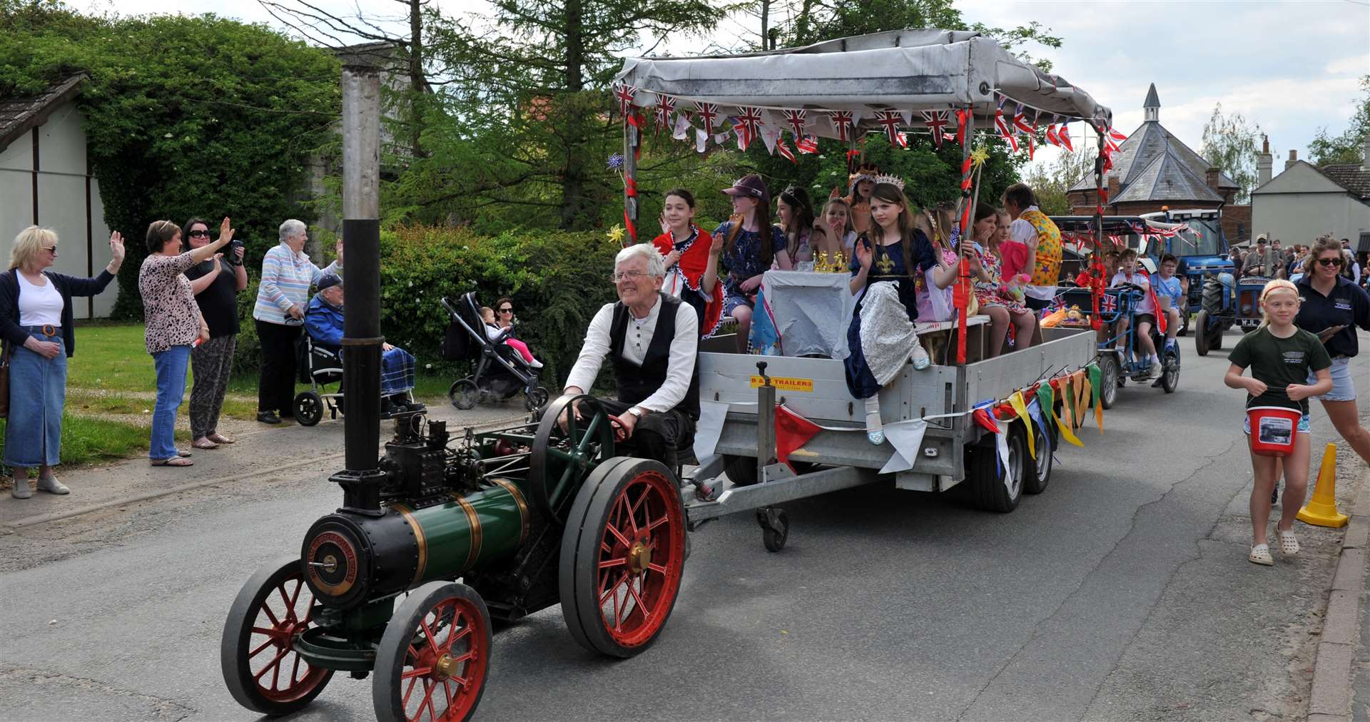 A vintage engine pulls a float