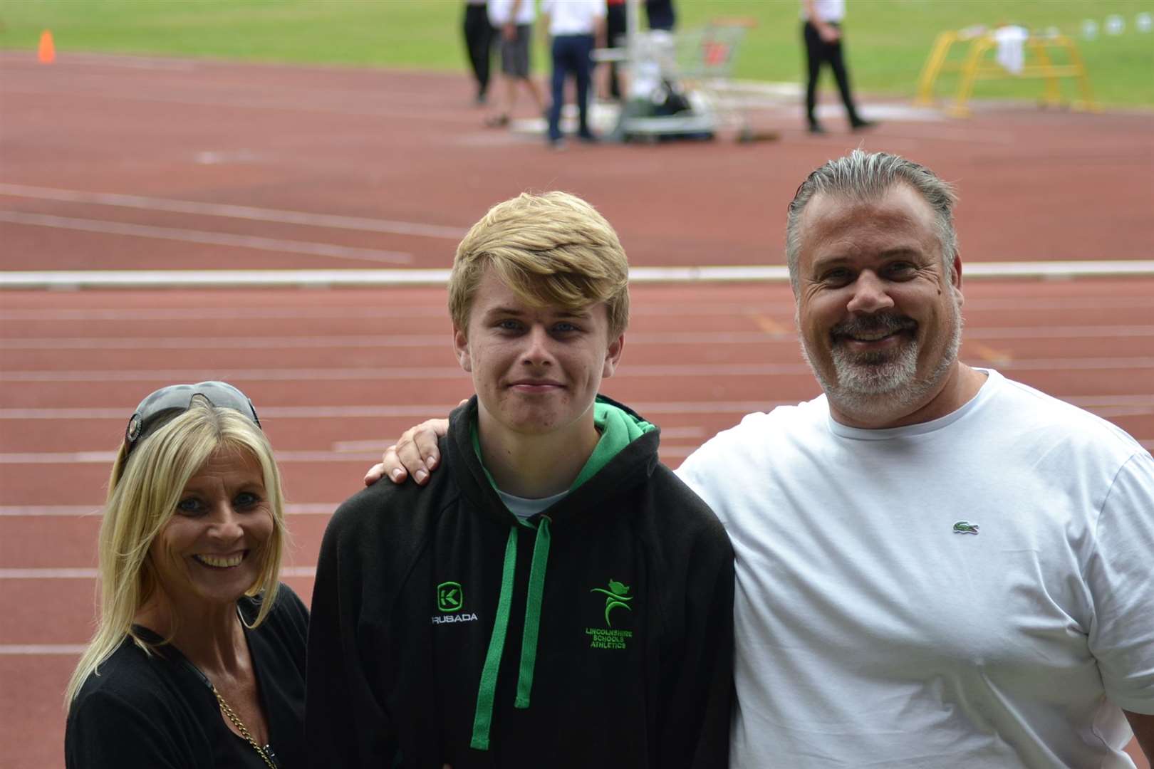 Donovan Capes with mum Samantha and dad/coach Lewis after winning the junior boys' shot put at the English Schools Track and Field Championships in Birmingham Photo supplied.