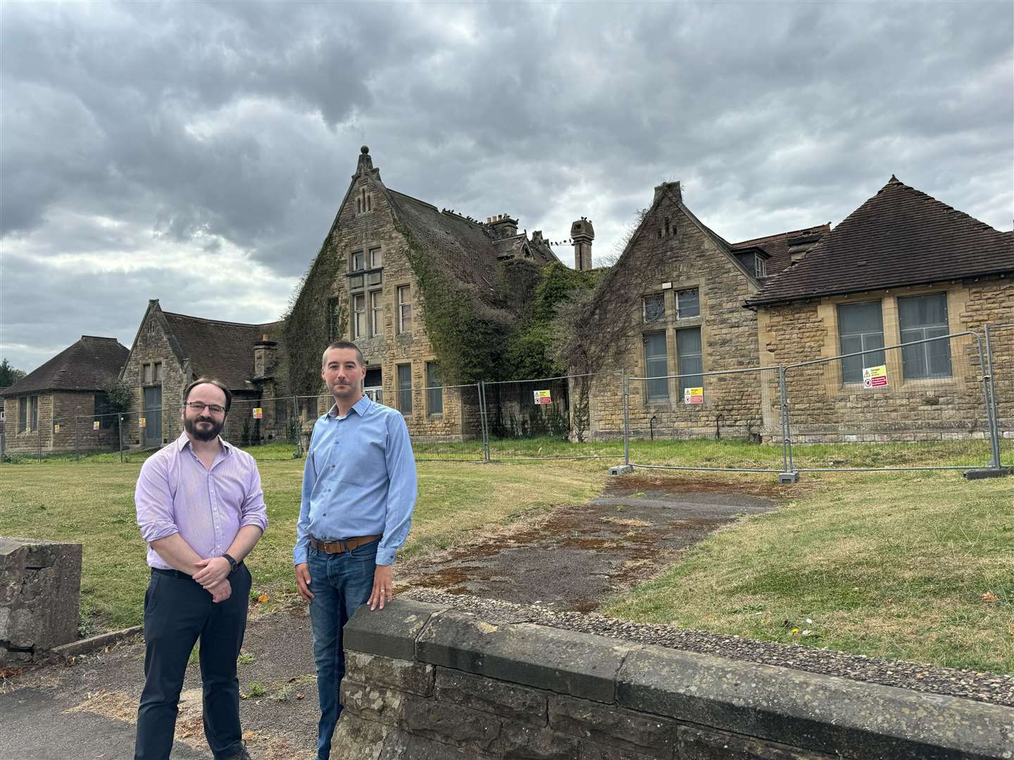 Councillor Paul Martin (left) and Councillor Matt Bailey (right) outside of the old Grantham Hospital site in Manthorpe Road.