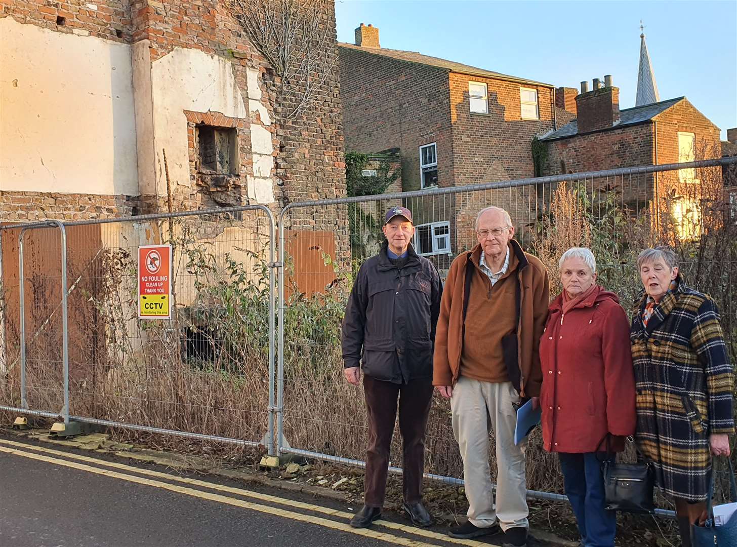The spire of St Mary's church can be seen in the background. L-R: John Clarey, Tim Machin, Joy Dowd, Wendy Jeffries