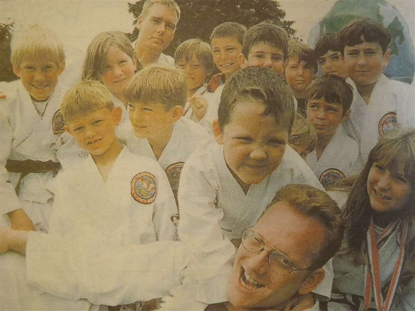 25 years ago: July 10, 1998 – Thomas Amos (6) grapples with dad Rick, while members of Stamford Global Tae Kwon-do Federation wait for their go.