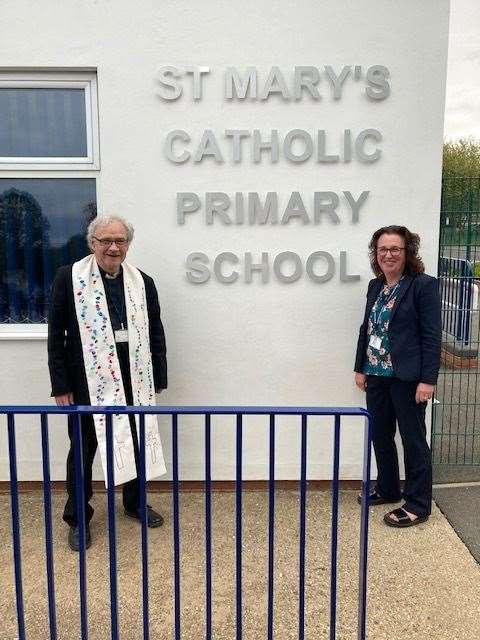 Father Chris wearing the stole given to him by St. Mary's school, standing with headteacher Rachel Wheatley (42298138)