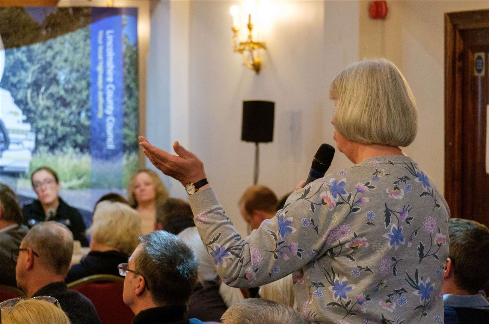 A resident gestures while making a key point during the debate. Photo: LCC