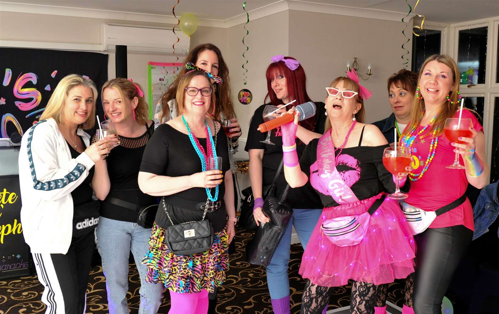Nice material, girls! Revellers enjoy the retro night. Photo: Chris Lowndes