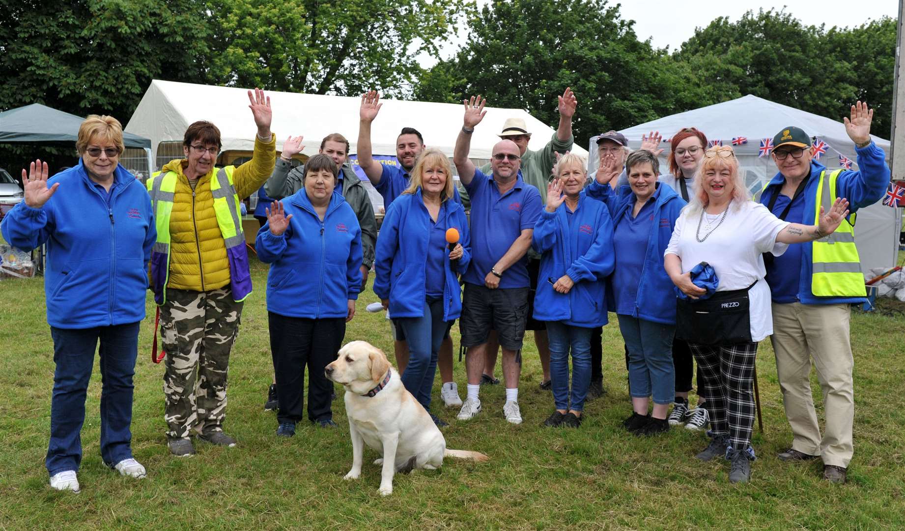 Organisers and helpers give the camera a wave