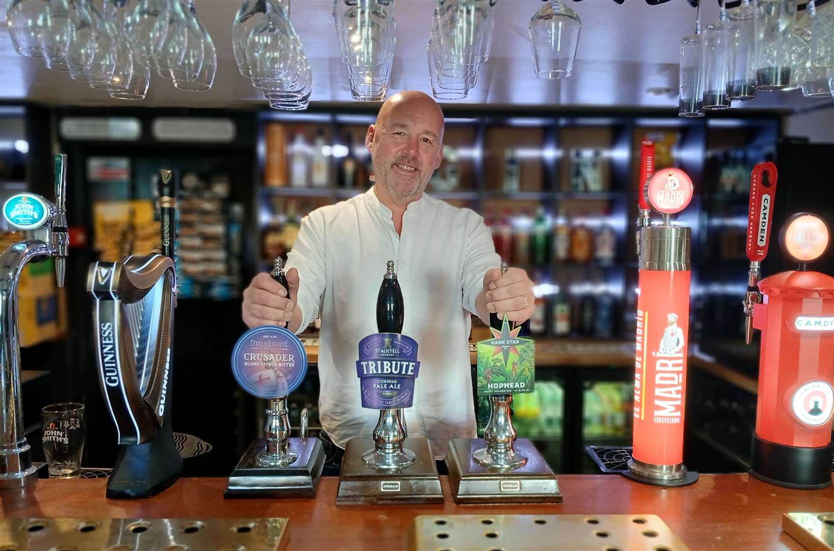Richard Hills, ready to serve behind the bar of The Millstone, Ryhall