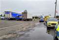 Multiple vehicles stopped on busy road