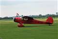 Vintage aircraft fly in