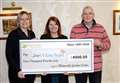 Business presents cheque to mental health charity