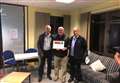 Award-winning fund-raiser presents cheque to men's mental health group 