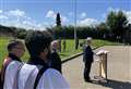 Large crowd pays respects at Armed Forces flag raising