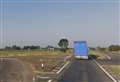 Main road closed and person taken to hospital after lorry crashes into ditch