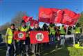 Workers take strike action over pay
