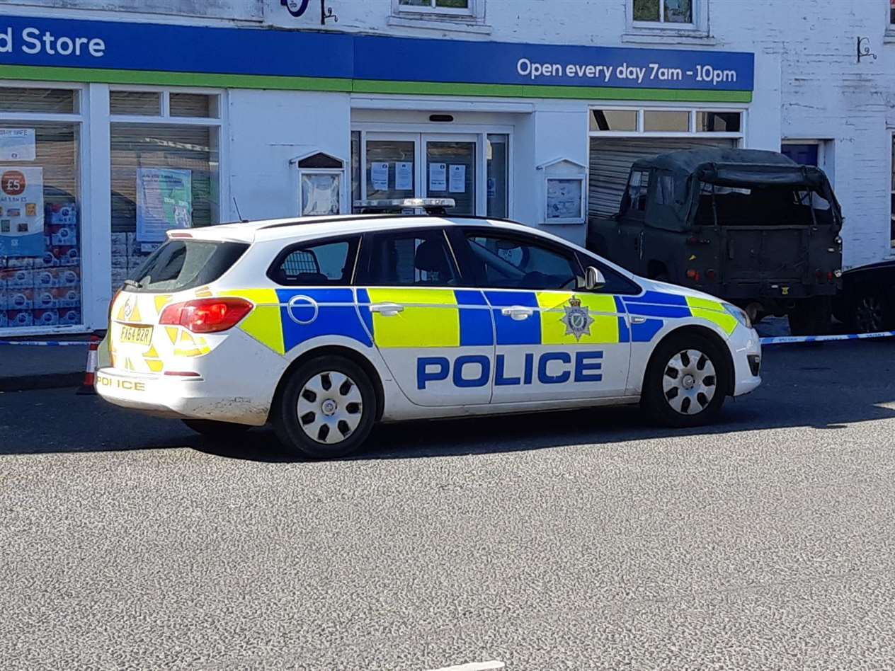 A green Land Rover is lodged in the window of the Lincolnshrie Coop store in Crowland (34378231)