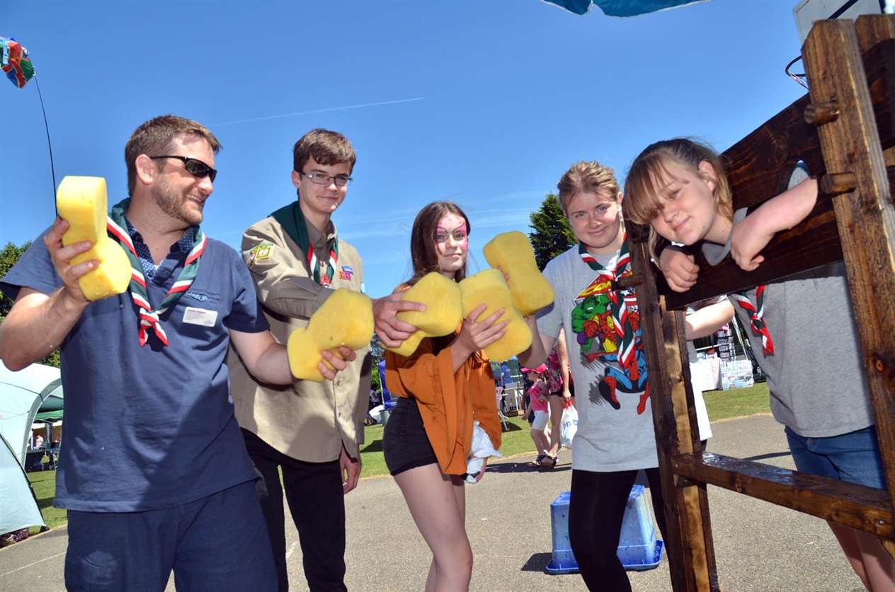 South Holland Explorer Scouts in the stocks with Leader Mark Dennis, Don and Nikki Thorp, Ellie-Mae and Emily Belokon-Dennis. Photo: 010718115SG.