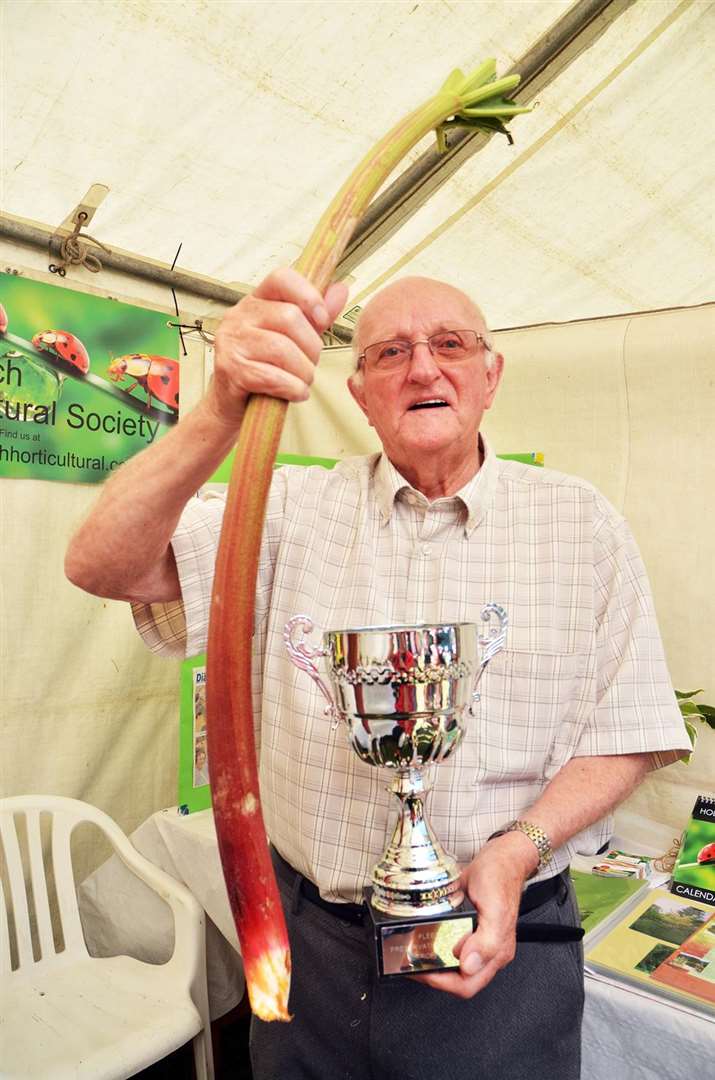 Alan Walsham with his prize-winning longest rhubarb. Photo: 010718127SG.