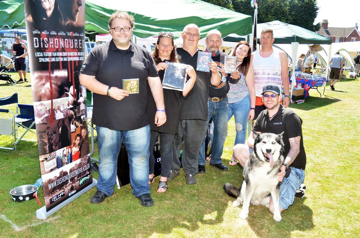 Steph Genovese, Natasha Newman, Steve O'Brien, Alex Belocom, Hayley Steven, Chris Newman, (front) Ross Beasley and Blade with the new Dishonoured DVD. Photo: 010718124SG.