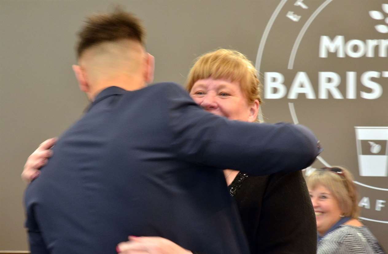 Sally gets a hug from a hunk ...