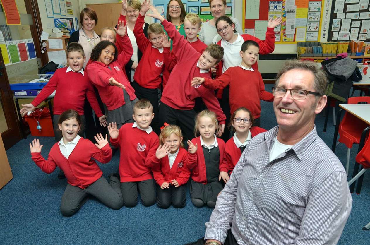 Retiring caretaker George Munn with staff and pupils at William Stukeley C of E Primary School in Holbeach. (5530124)