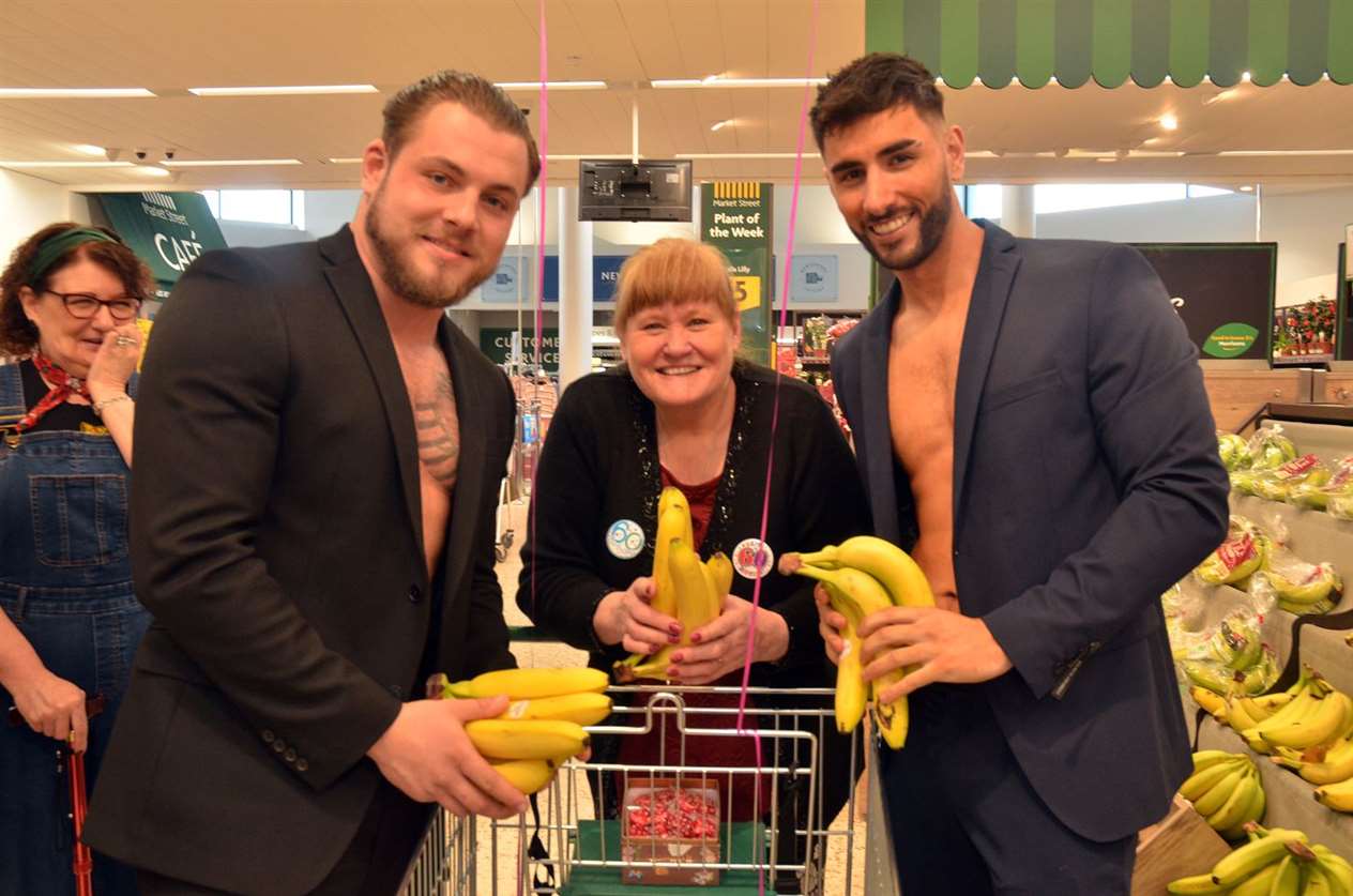 Checking out the prime produce - Sally with Luke and Jake