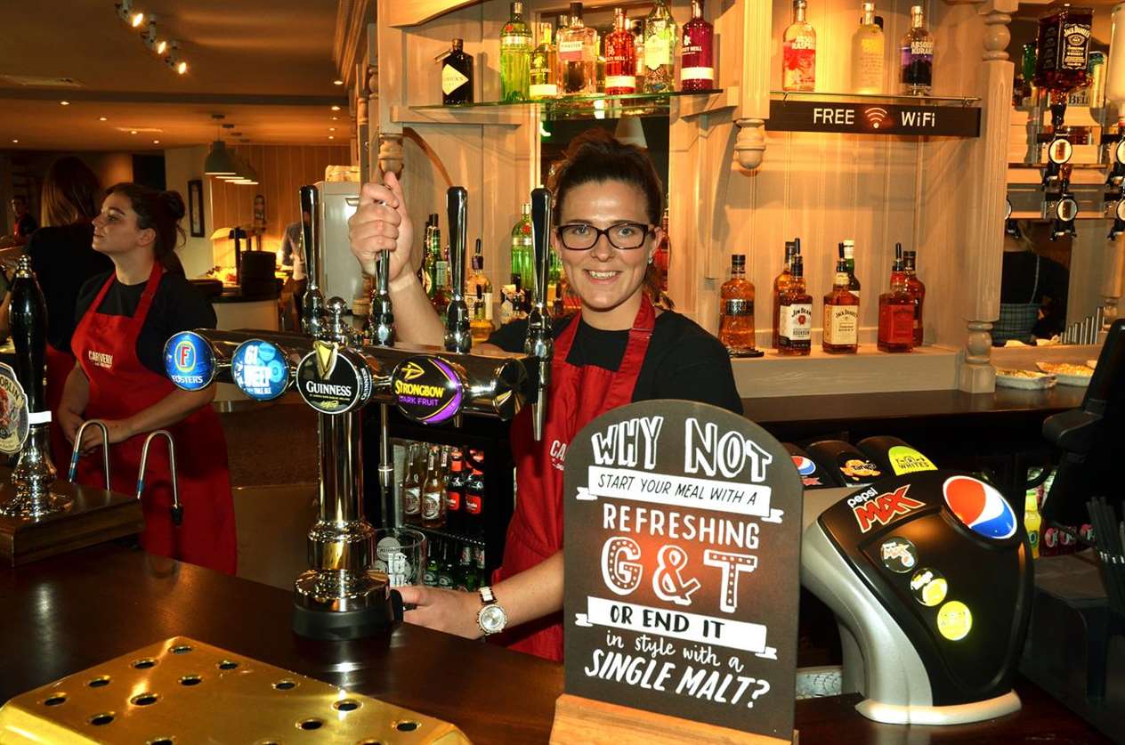 A front-of-house staff member at the bar. Photo (TIM WILSON): SG-210918-028TW