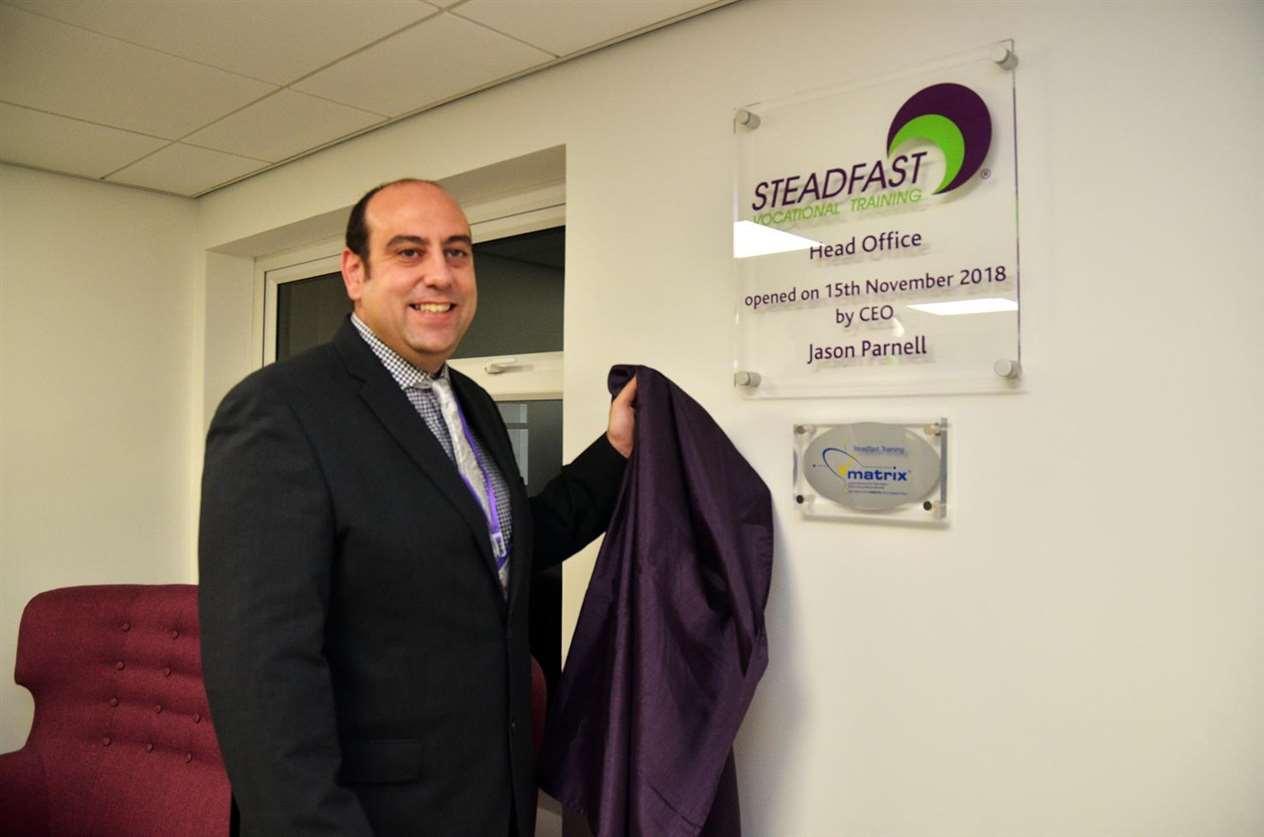 CEO Jason Parnell reveals the ceremonial plaque at the official opening of Steadfast Training's new office at 3-5 Enterprise Way, Pinchbeck. (151118-26)