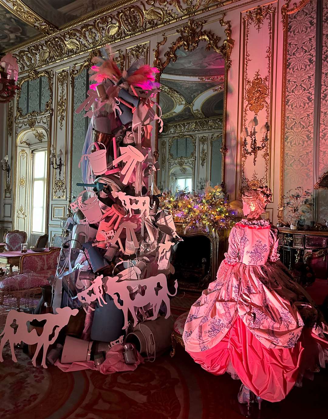A glamorous depiction of eight maids are milking