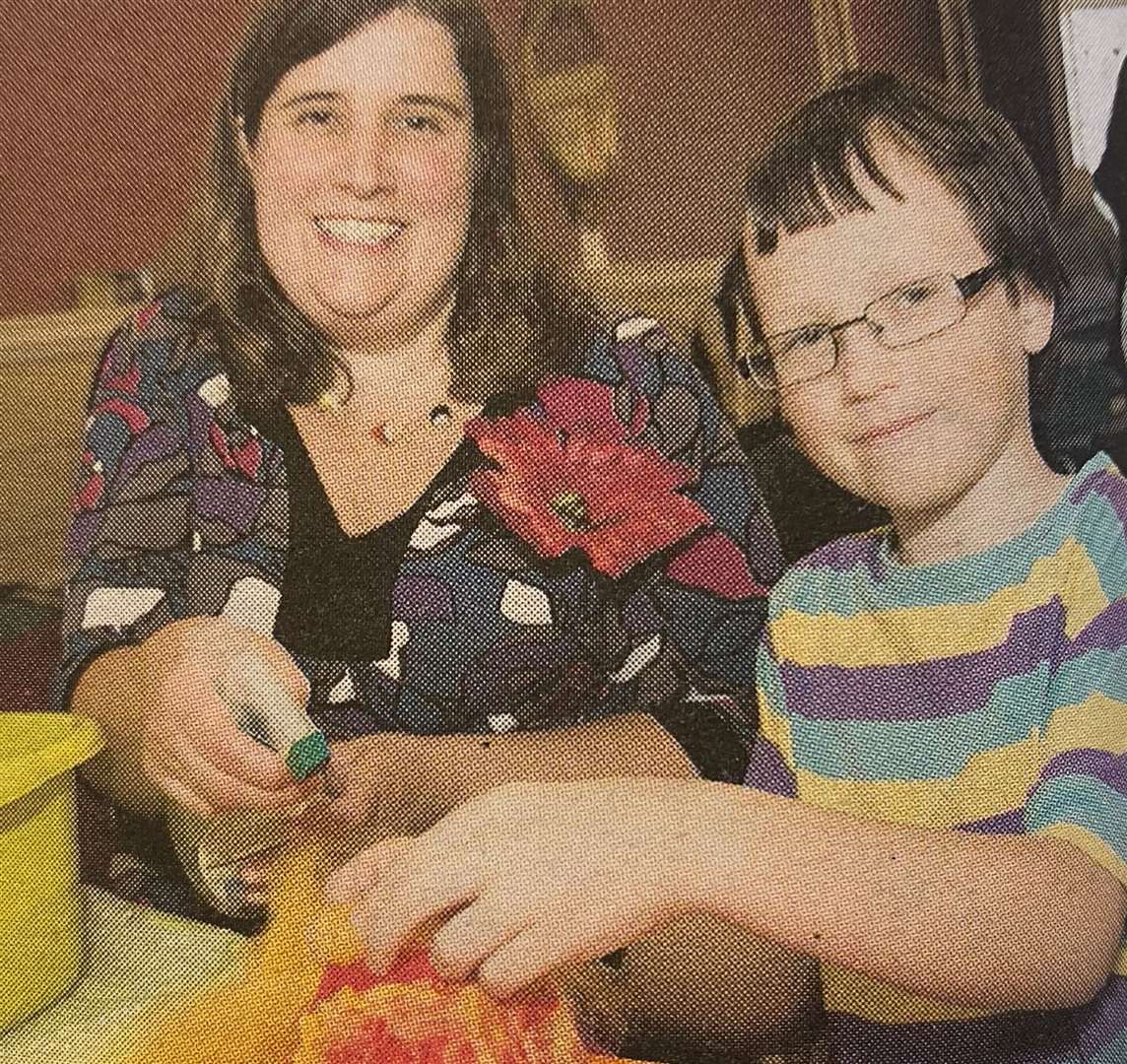 Eve Marshall helping Alex Williams at the apple felting 10 years ago.