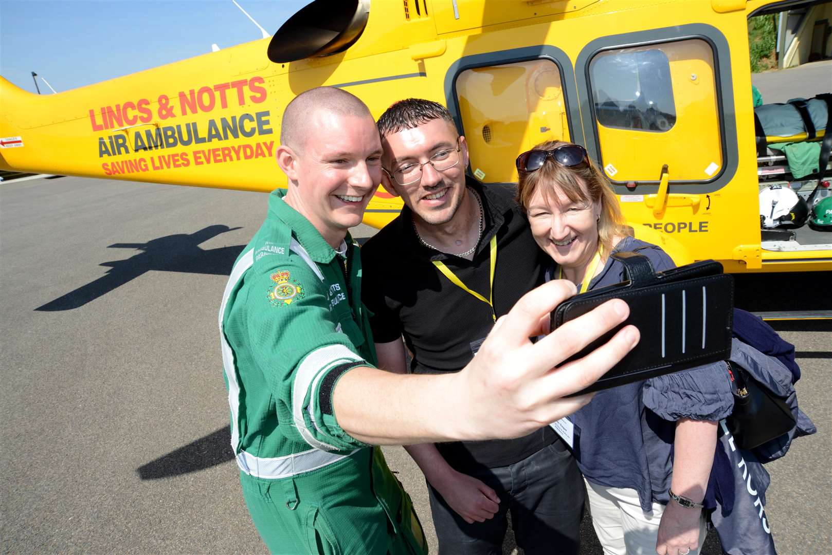 Paramedic Matt Moore with patient Craig Metcalf and his mother Karen (10233928)