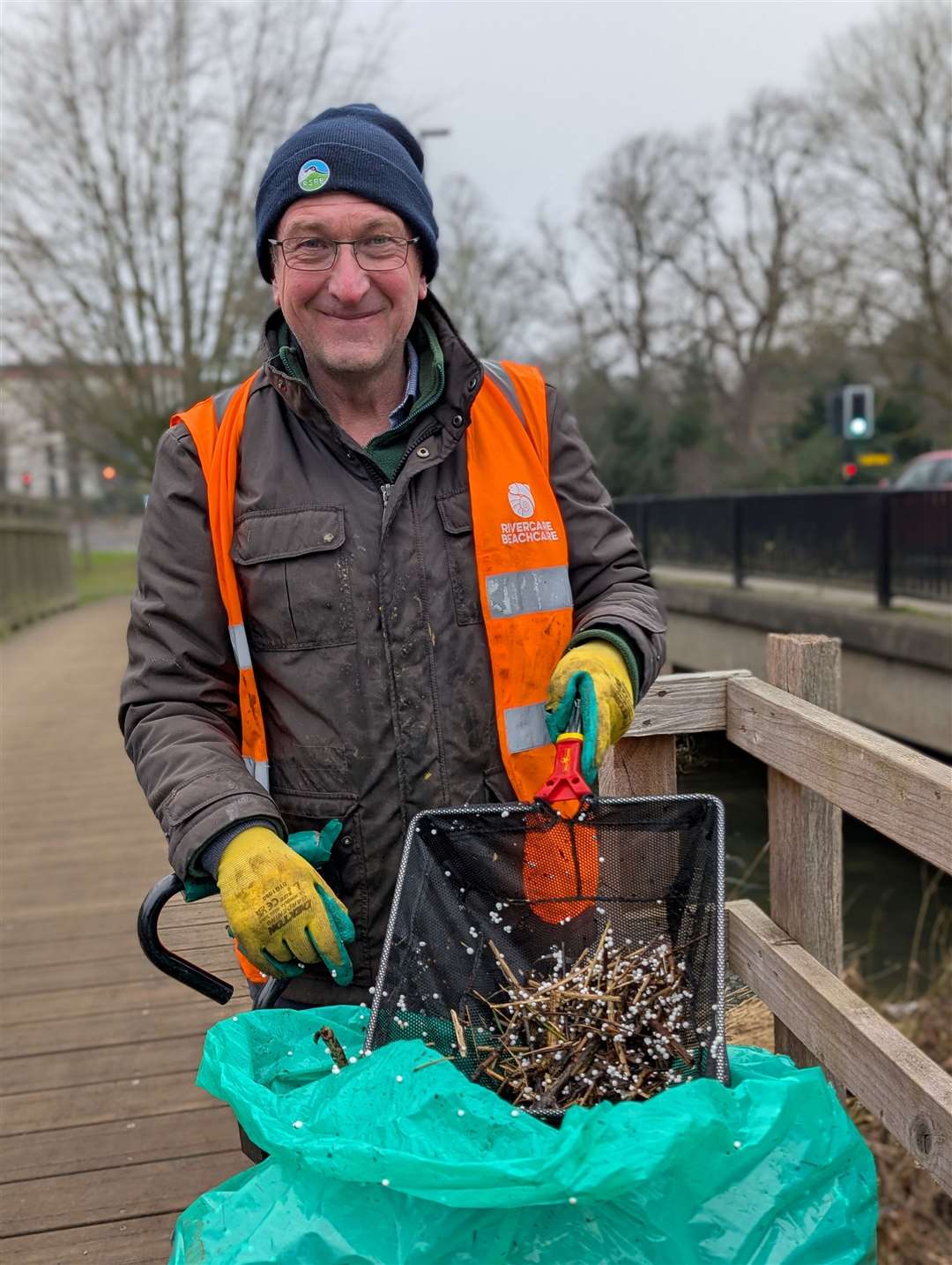 Volunteers used dustpans and brushes to clean up the bean bag beads.