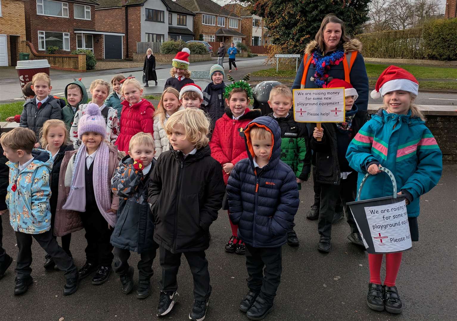 Children singing outside Nisa in Stamford.