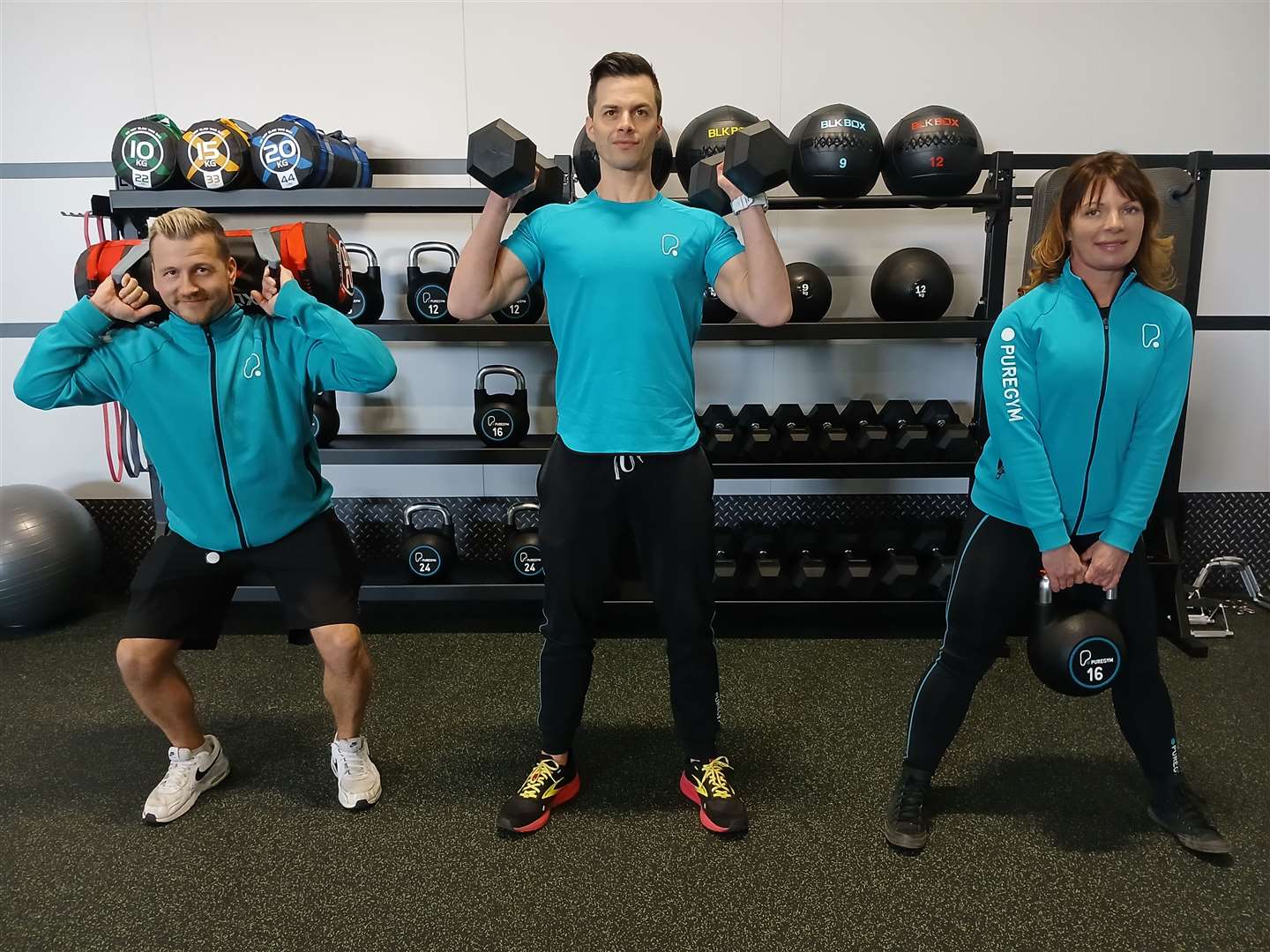Managers Rob Hope, Billy Lee and Isla Oliver in the free weights area