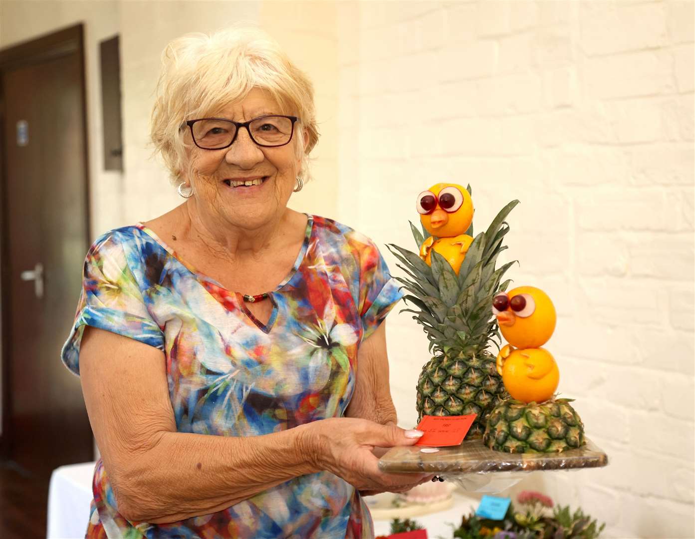 Craft judge Josie Williams shows off one of the winners