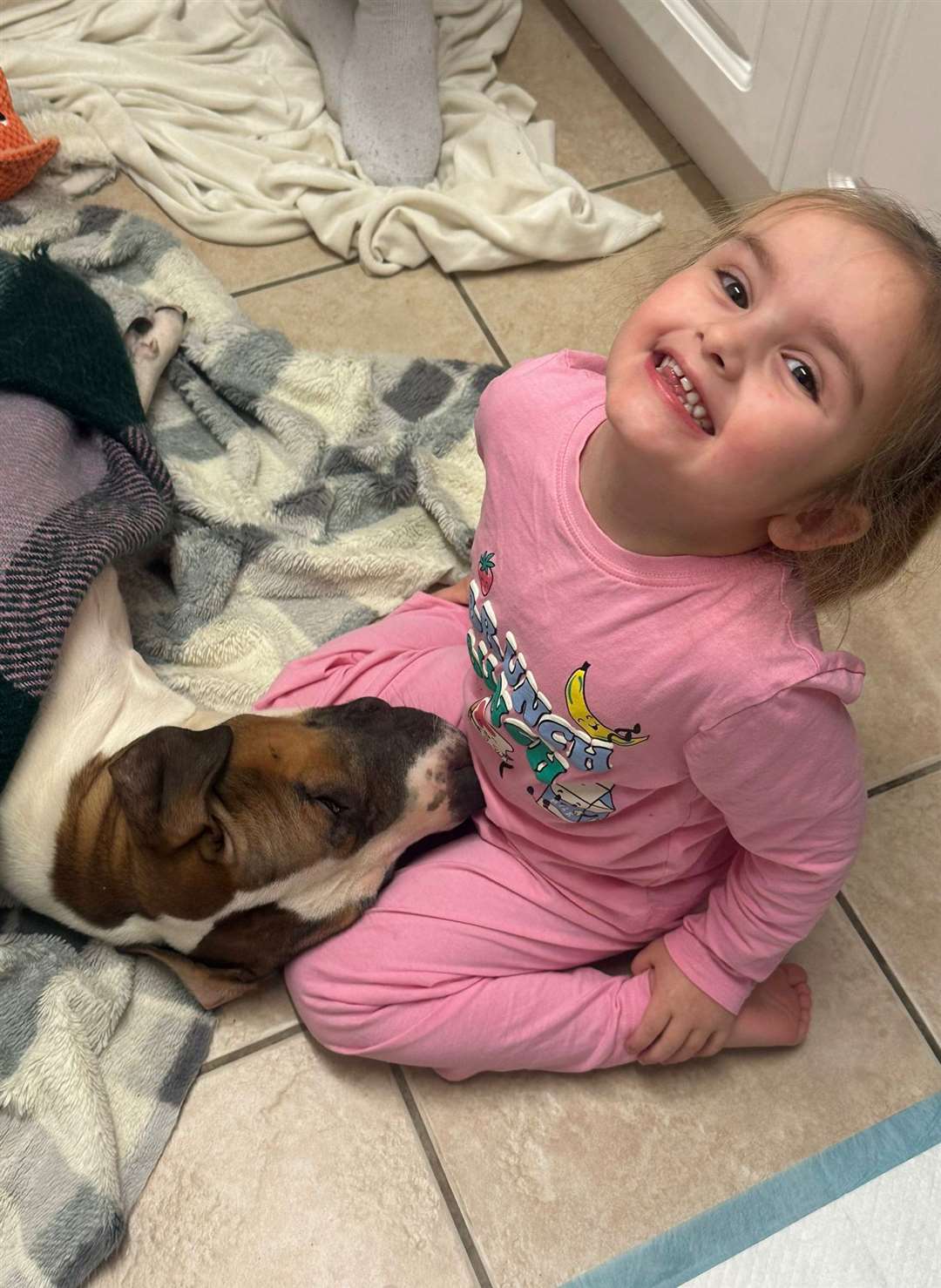 Sarah's daughter Ellie with Lola who is very gentle with the youngster