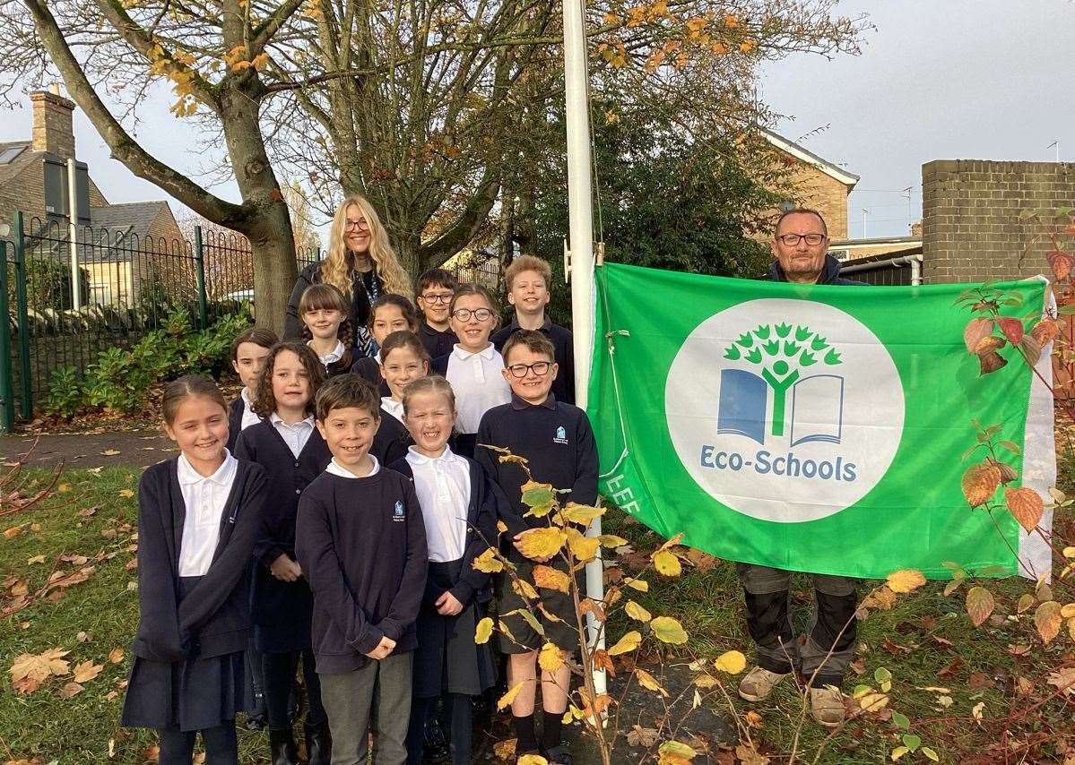 Pupils at St Gilbert’s School in Stamford with a green flag