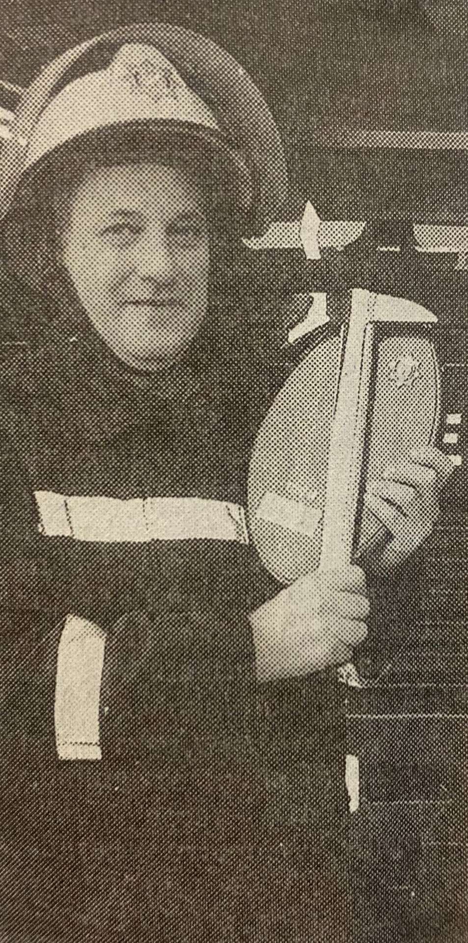 John Fordham with an axe and shield presented to him after he retired 25 years ago.