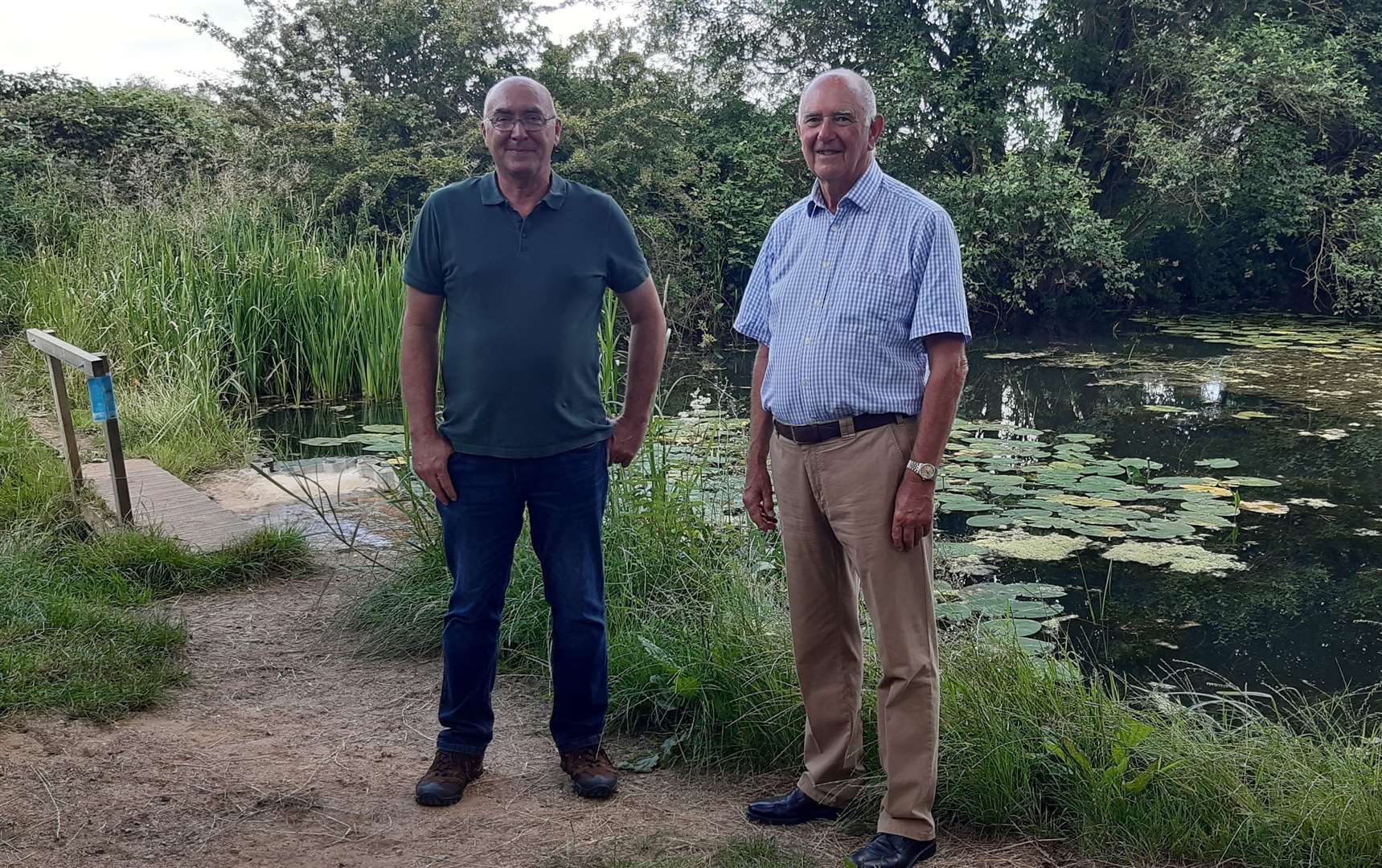 Oakham Canal Green Corridor Project manager Paul Dadford, left, together with St John and St Anne chairman of governors David Pattinson at the dam on the canal just prior to signing the permissive path agreement