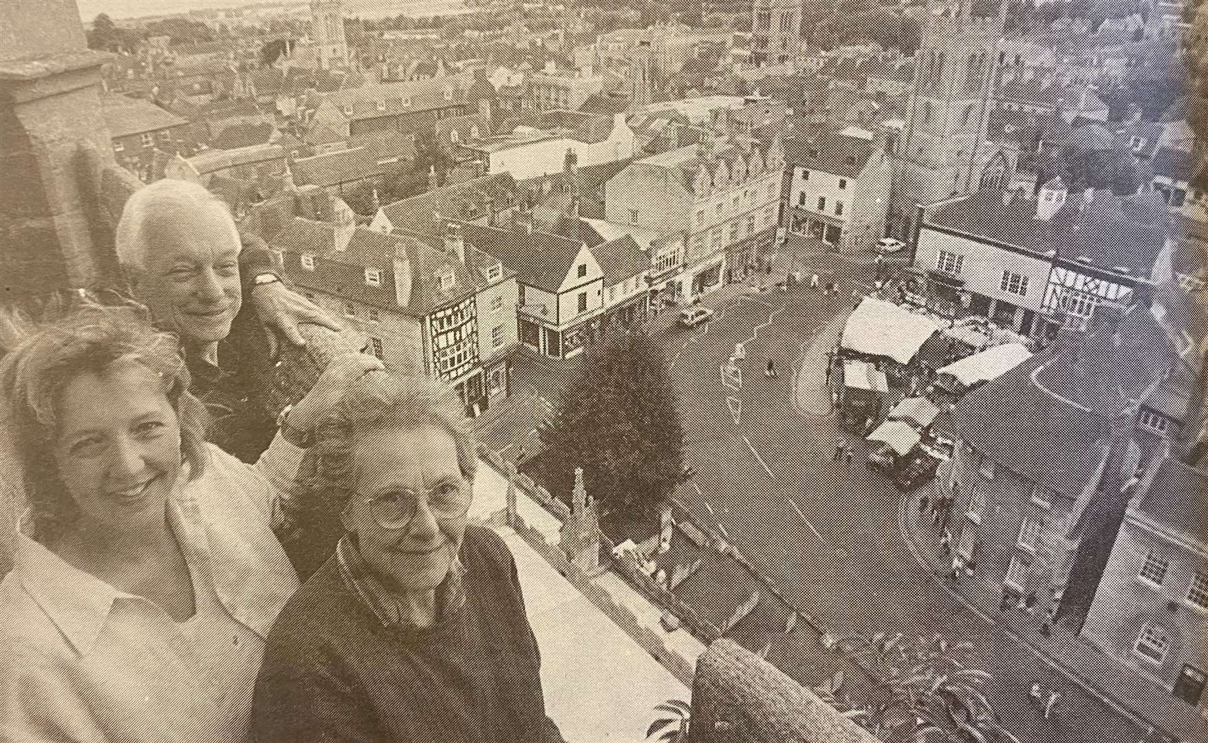 Dr Donald Gray, Clare Gray and Joyce Gray enjoy a lofty view over the rooftops from the tower of All Saints' Church 25 years ago.