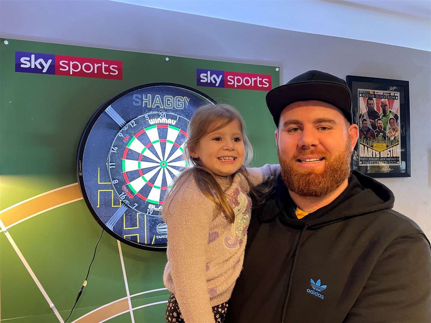 Oche ace Scott Williams with daughter Aurora