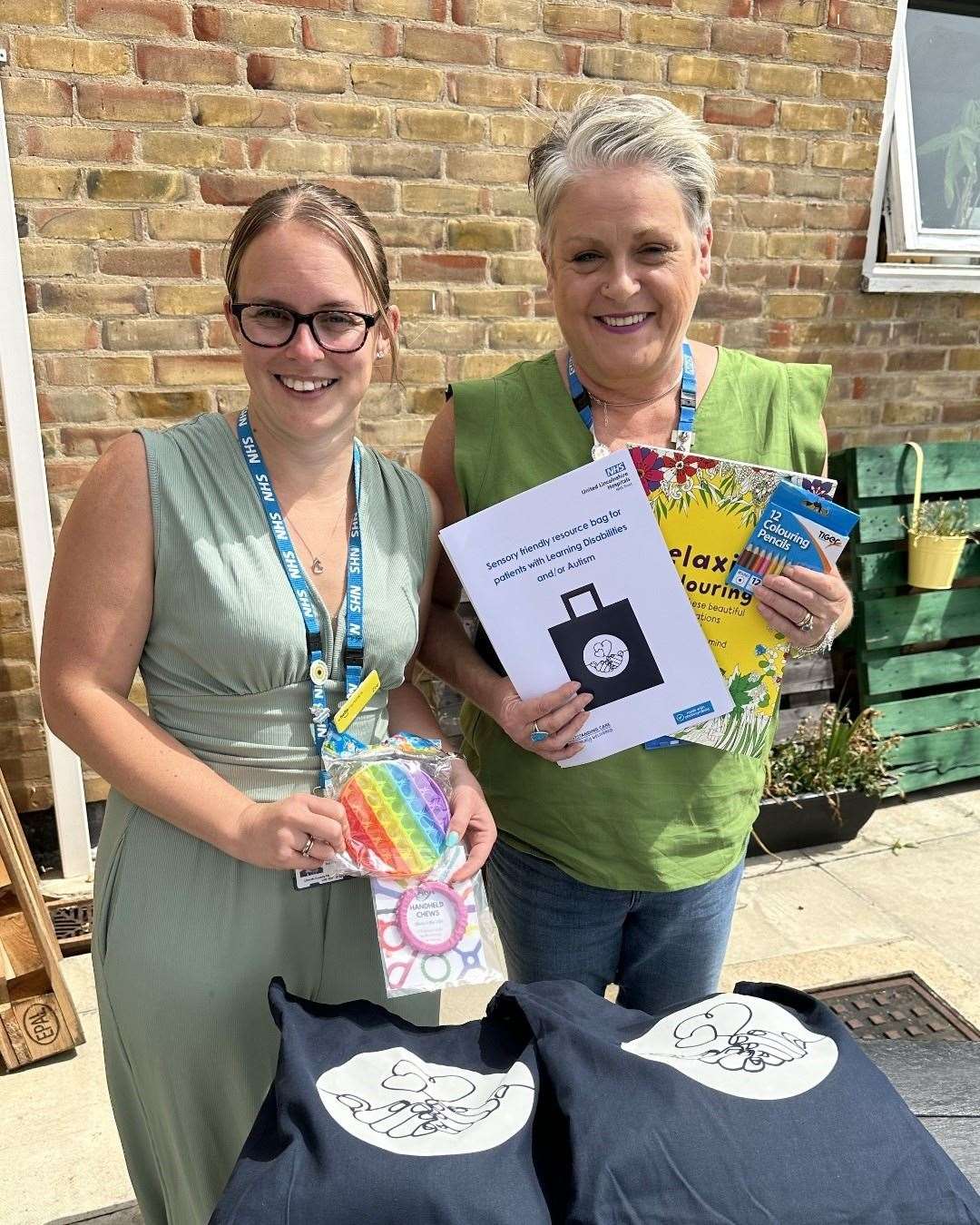 Safeguarding and vulnerabilities nurse specialist for Dementia Zoe Chapman and patient experience manager Sharon Kidd with the bags. Photo: ULHT