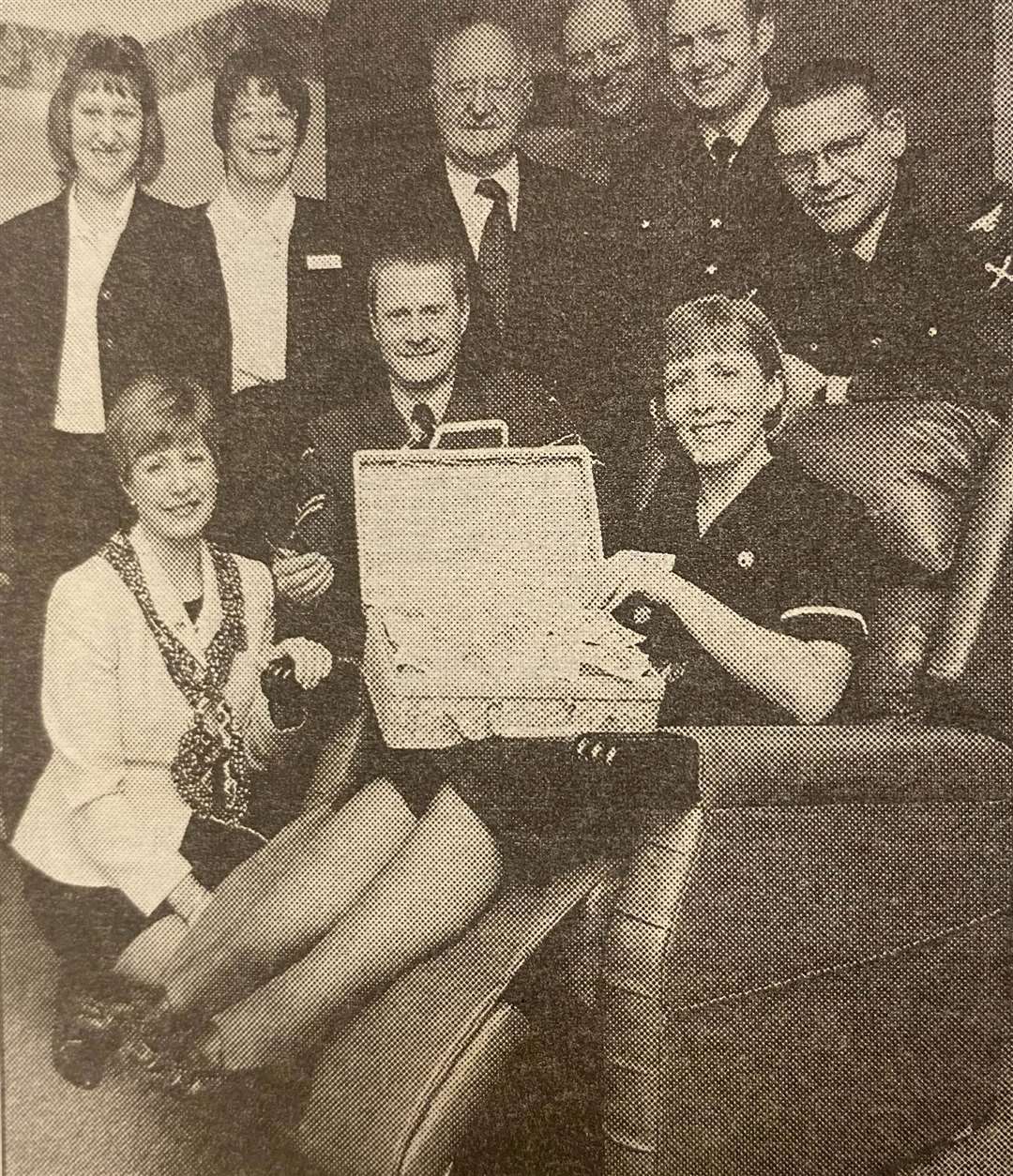 Sister Allison Grey tests out the home's new recliner chair 25 years ago.