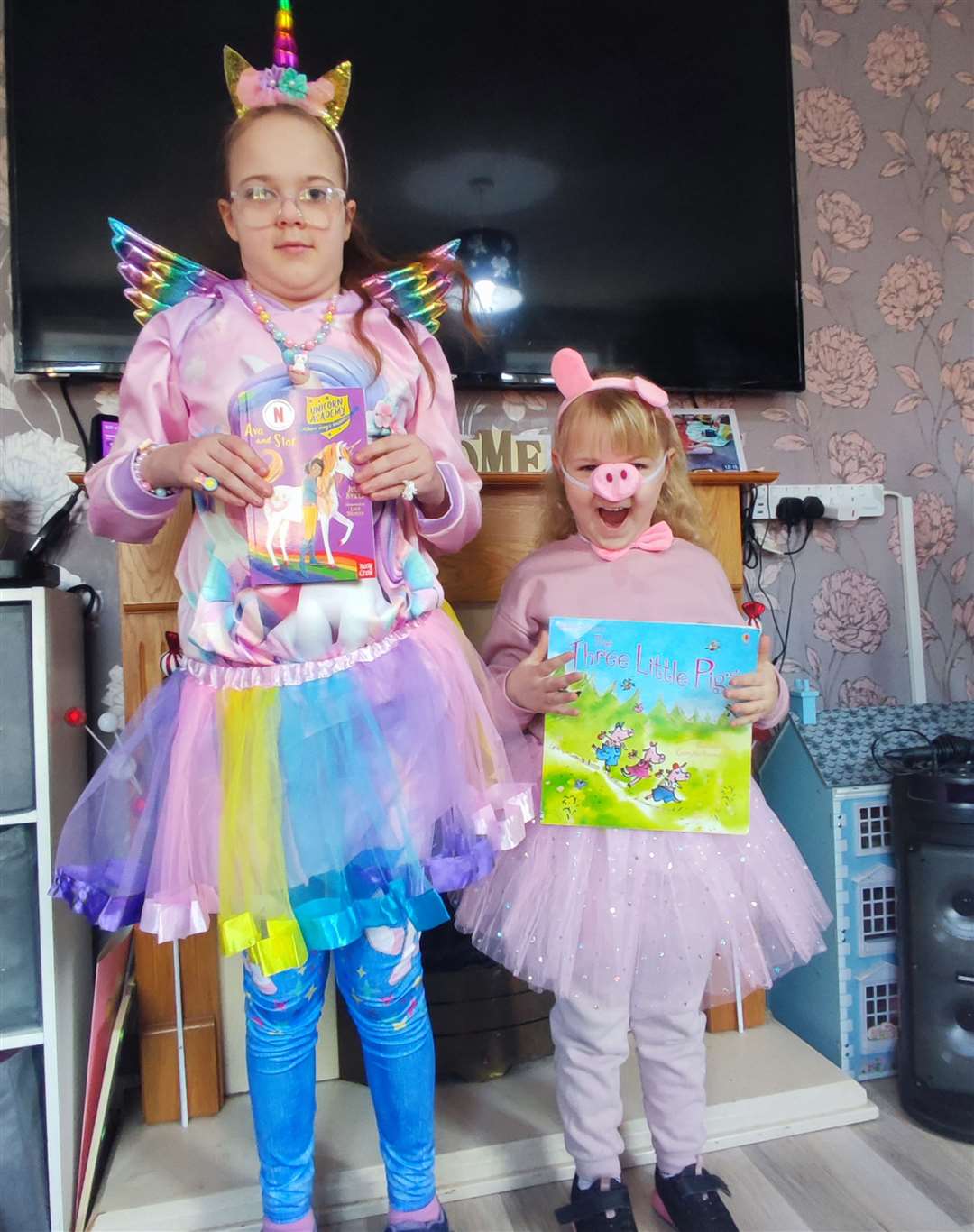 Amelia, 10, dressed as a unicorn and Sophie, five, dressed as a little pig, from Sutton Bridge