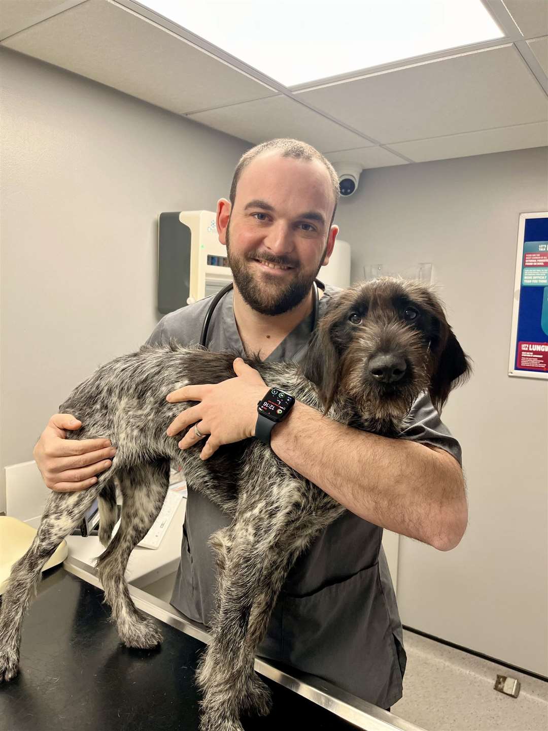 Lee with practice manager Charlotte's German wire-haired pointer, Ginny. Photo: Supplied