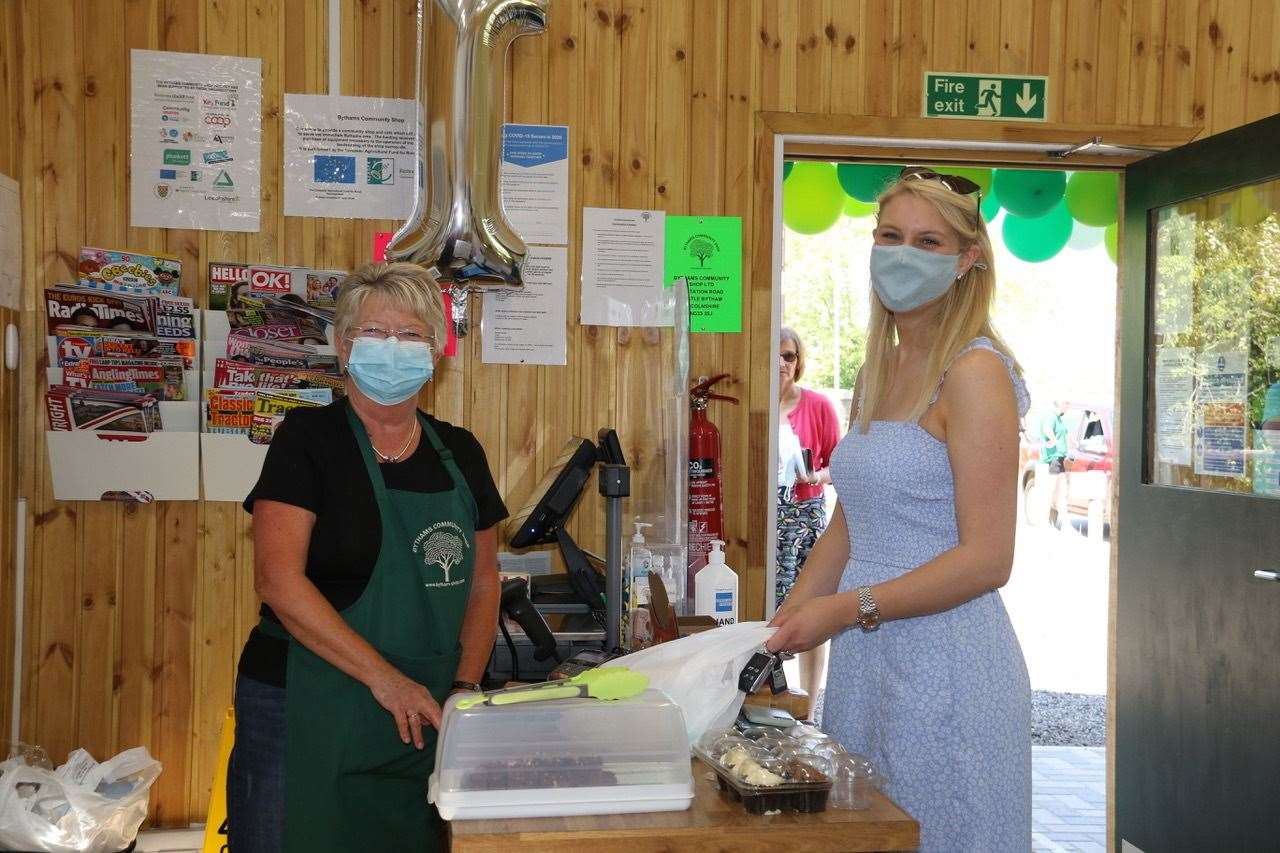 Volunteer Cathy Welham serving customer Emma Spedding. Photo: Alan Harvey