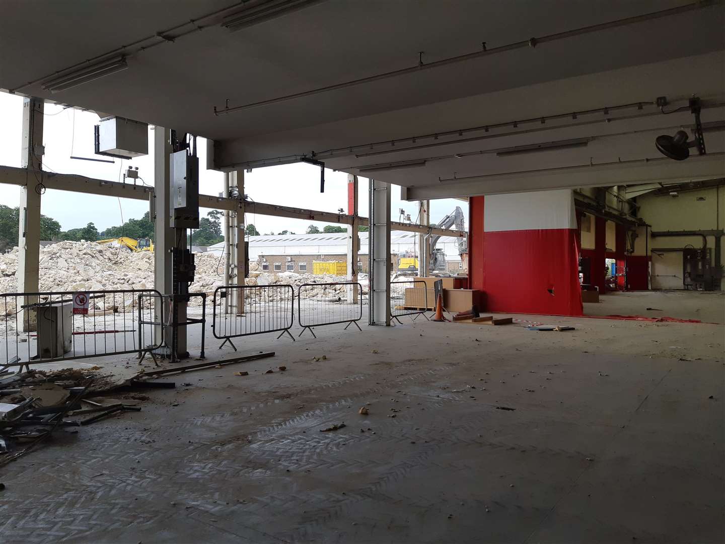 A partly demolished building at the back of the site (57924764)