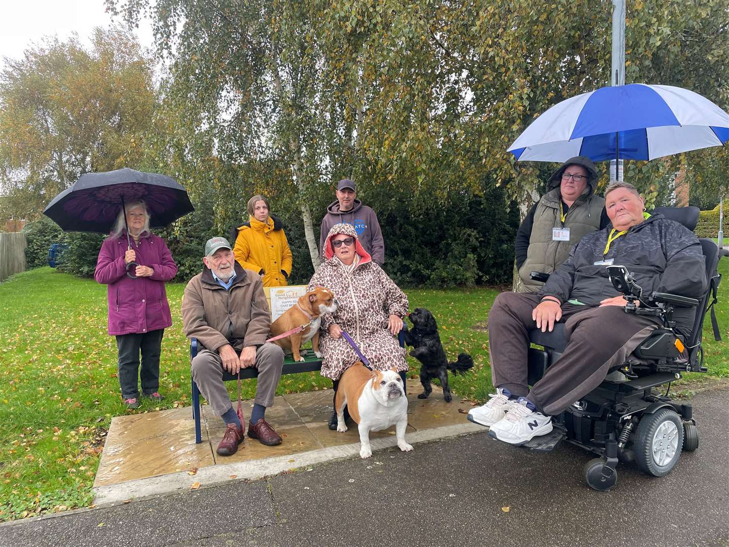 Coun Rob Jarvis (right) with villagers enjoying the chatter and natter bench