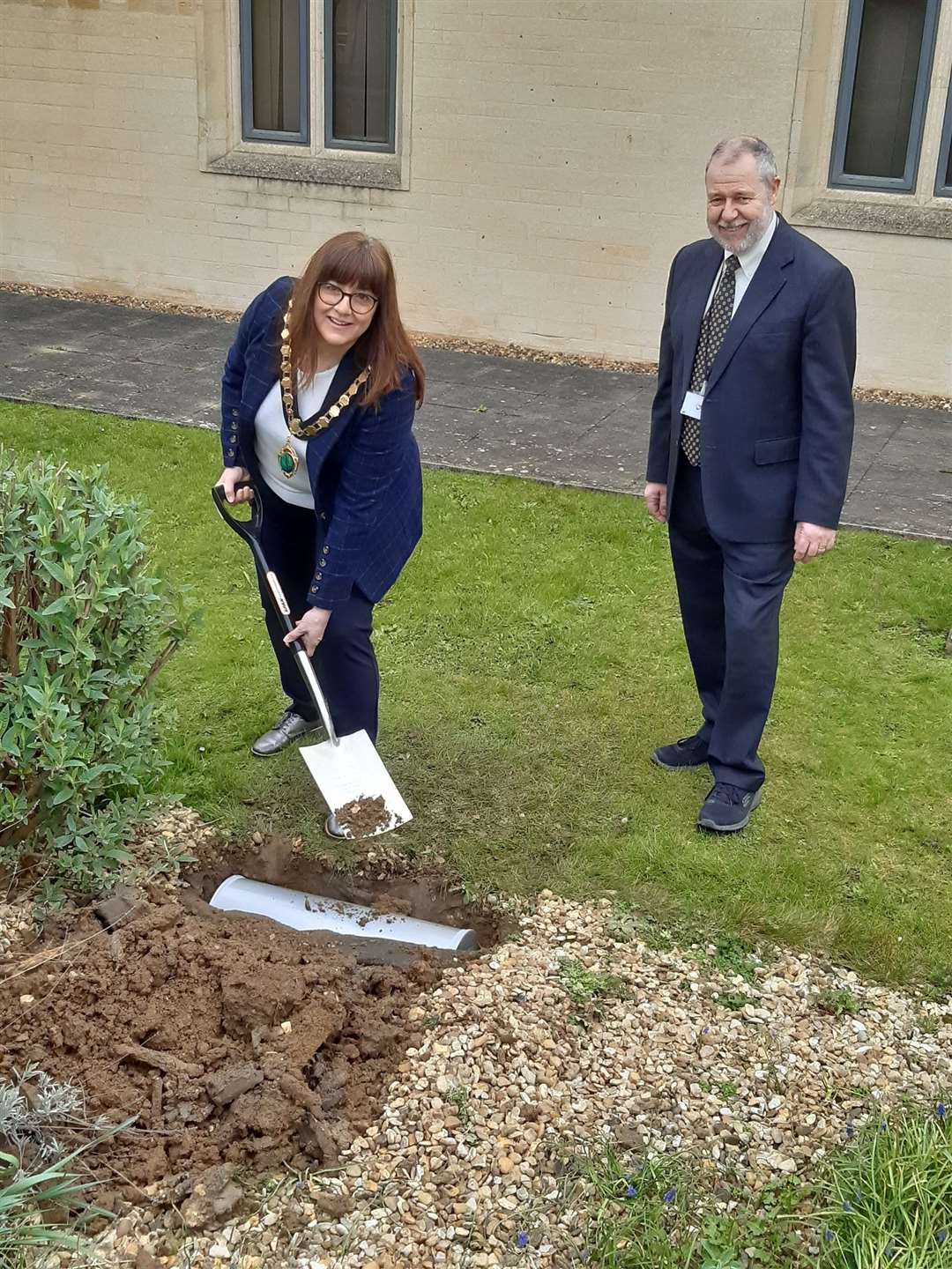 East Northamptonshire Council's chairman, coun Helen Howell, and chief executive, David Oliver buried a time capsule to commemorate the end of the council